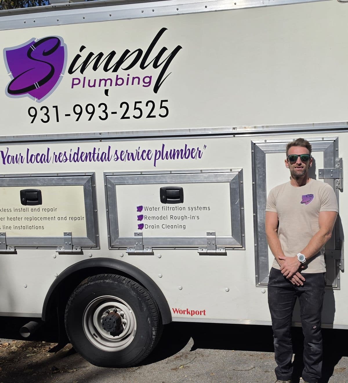 Matt Allen, owner of Simply Plumbing, standing beside the company truck
