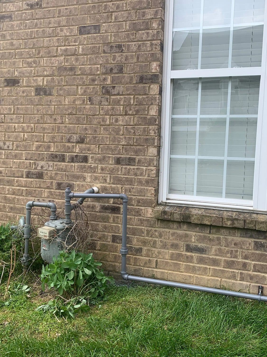 New gas line run from the meter along the brick wall of a Murfreesboro home
